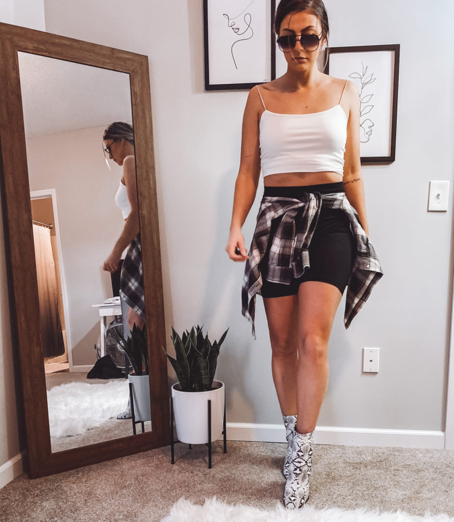 Bike shorts paired with snake skin booties and flannel
