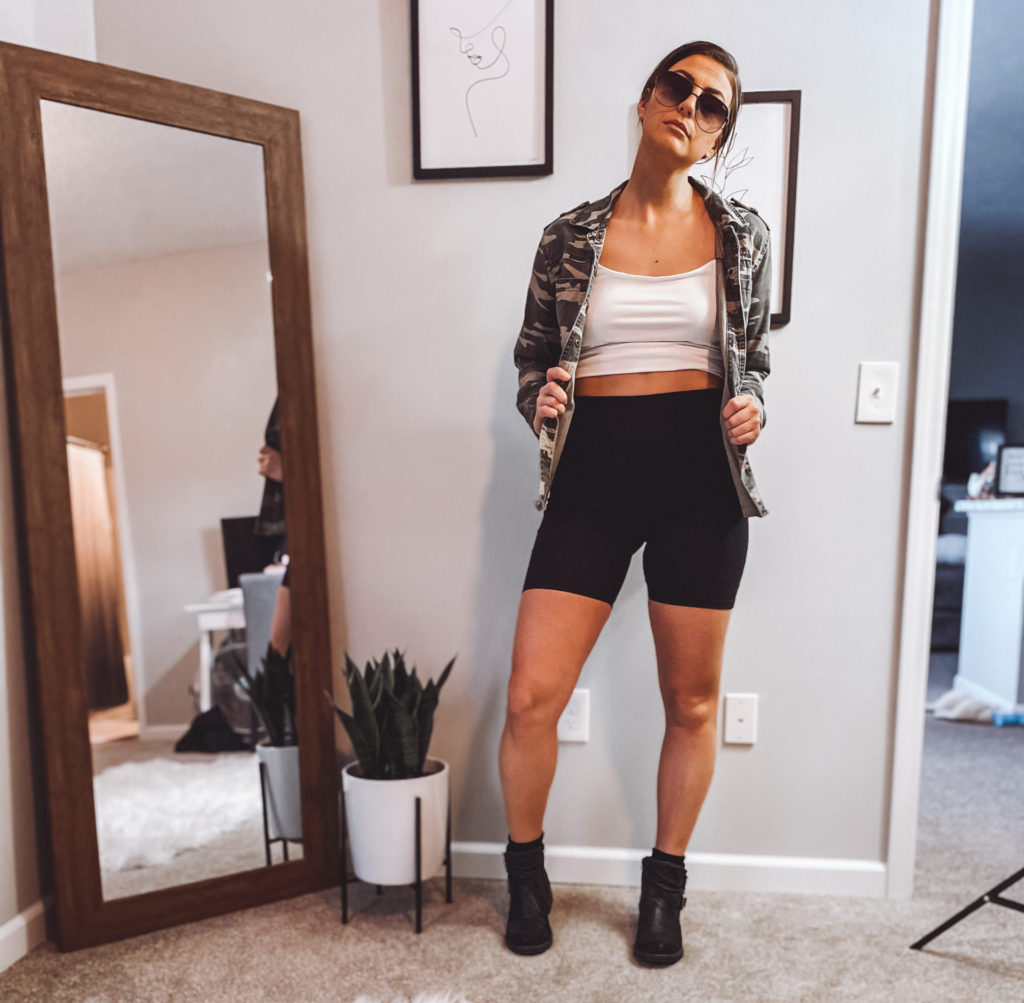Bike shorts with combat boots, camo jacket and crop top
