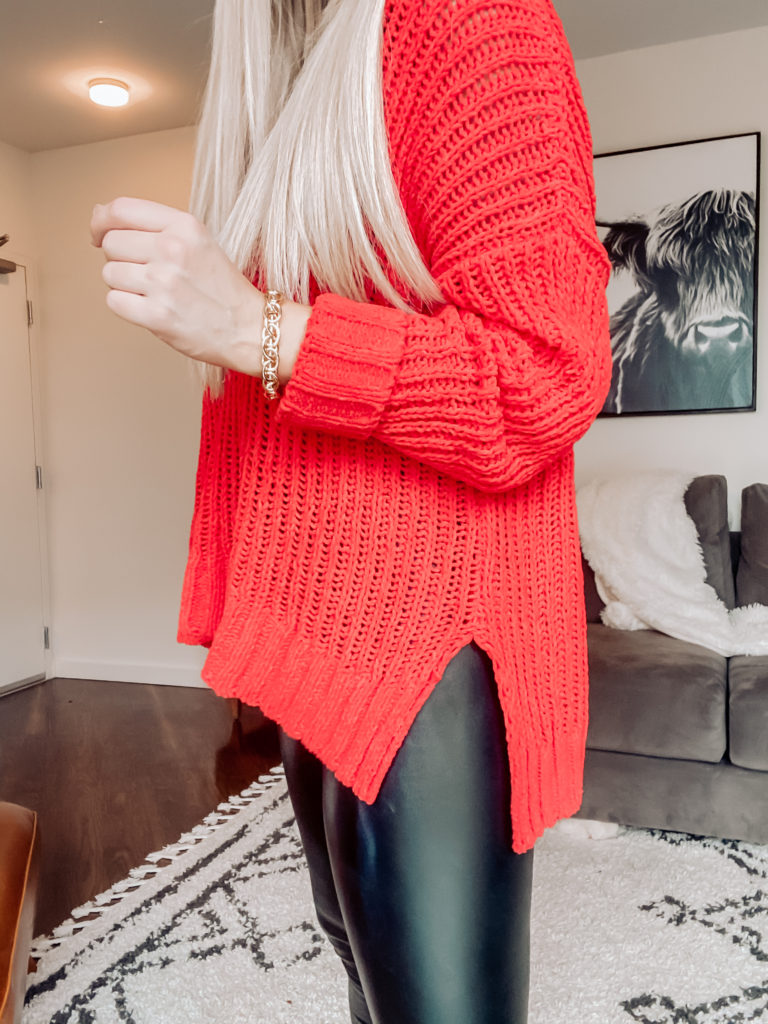 red sweater and faux leather